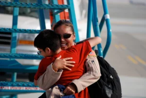 Veteran hugging child. Veteran assistance